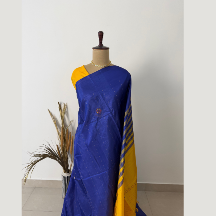 Royal blue banana fibre saree with mustard yellow border and pallu, featuring a textured finish and elegant contrast design, ideal for festive and ethnic wear.